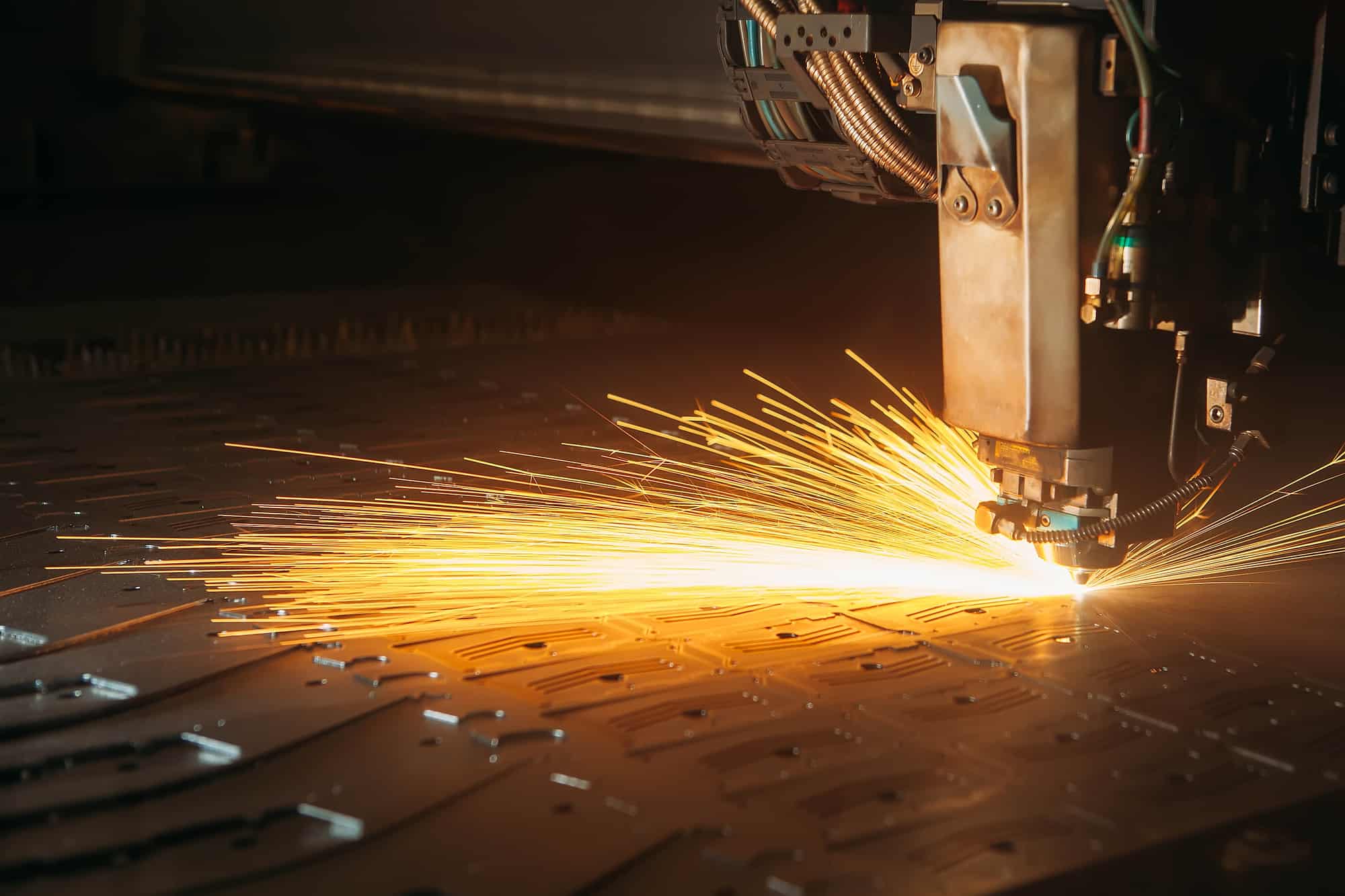 Laser cutting machine cuts the metal with sparks Laser cutting machine cuts the metal with sparks industry 4.0